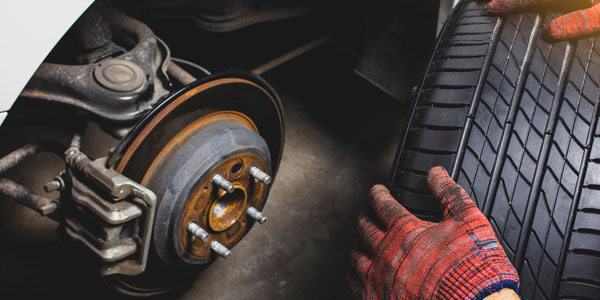 Mechanic Working On Tire